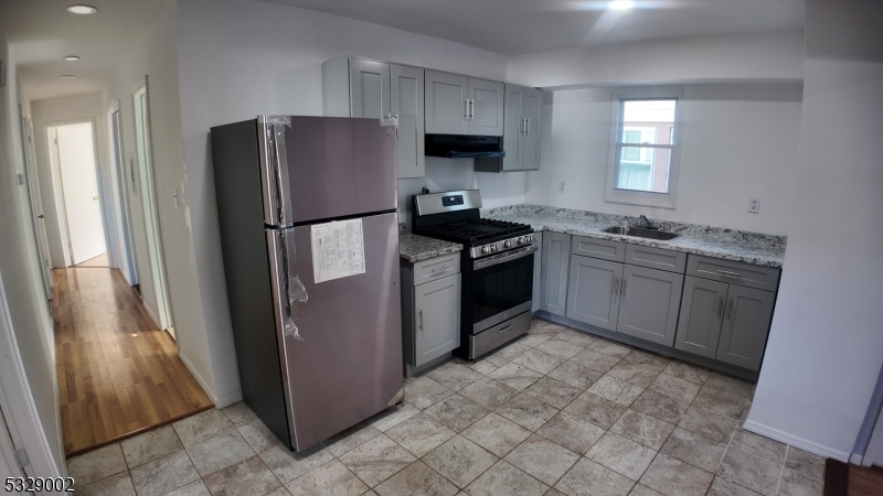 Spacious 4-bedroom, 1-bathroom apartment in the heart of Elizabeth NJ with all utilities included. Features a large private backyard. Conveniently located just minutes from Route 1-9, public transportation, and shopping centers. Only 30-40 minutes from NYC, making it perfect for commuters!