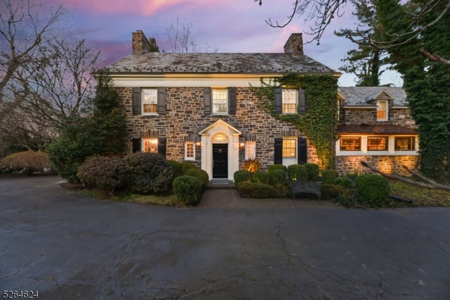 Ideally located in one of Madison's most sought after neighborhoods just blocks to town, train and schools this architectural stone masterpiece is sure to impress with curb appeal galore. Set on .87 private acres this stunning 5 bedroom, 5.1 bath residence enjoys many tasteful recent renovations. The main level features a foyer that opens to a living room with fireplace, office with wood paneling, banquet size dining room and large family room with gas fireplace, two seating areas, custom built-ins and nicely set just off the kitchen and breakfast room.  A new mudroom with custom built -ins by Chuck Bischoff, renovated powder room and a 2 car heated garage complete this first level.  The second level boasts 4 bedrooms and 3 full baths, 2 bedrooms are en-suite.  The primary suite is the perfect retreat with spa like bath, two sinks, large soaking tub, shower, walk-in closet and dressing room.  The third level newly finished boasts a bedroom, ensuite bath and storage. This versatile space easily could be used as a second office or studio.  Sure to impress the newly renovated basement enjoys a wet bar with wine fridge, recreation room with reclaimed wood and fireplace, exercise room, full bath, laundry and workroom.  The tranquil outdoor space, professionally landscaped includes a large bluestone patio perfect for alfresco dining and entertaining and a fenced in yard. This home boast many other features and updates and truly is an amazing opportunity you do not want to miss!