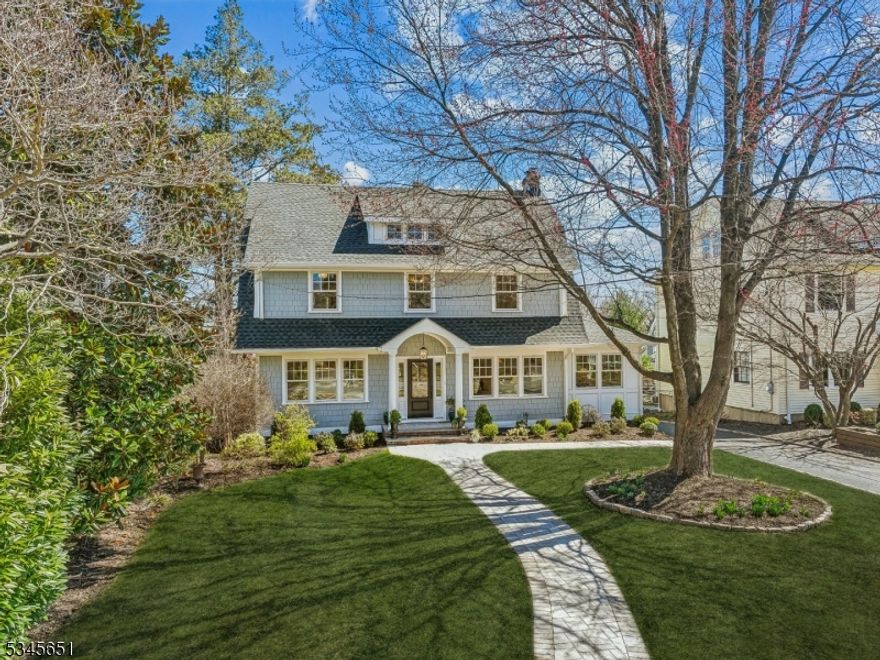 This exceptional home blends timeless elegance with contemporary luxury. Just blocks from Watchung Plaza's shopping, cafes, fitness studios, and NYC train & bus access, this gut-renovated gem boasts an expansive footprint with a substantial 3 story addition. Step inside to discover a chef's dream kitchen, featuring a large center island, top-tier appliances, and an open flow to the expansive family room with a fireplace all connecting to a rear deck & generous patio for indoor-outdoor entertaining. The living room with a fireplace, a sunroom, elegant dining room, butler's pantry, mudroom/laundry center & a stylish powder room. The second floor is highlighted by a vaulted & beamed primary suite with a serene spa-like bath, including a soaking tub & oversized walk-in shower. Two additional bedrooms share a Jack-and-Jill bath, while a fourth bedroom enjoys its own en-suite retreat. Ascend to the 3rd floor to find two more spacious bedrooms & a fourth full bath, perfect for guests & home office. The finished lower level is designed for modern living, with space for a home gym & an incredible family room with double walkout doors to your backyard oasis. No expense spared in the quality of finishes and appliances including full sized SubZero refrigerator & freezer,  60" 6 burner & griddle Wolf range, Marvin windows, custom cabinetry & Emtek door hardware, and incredibly thoughtful schematics incorporated allowing for every media/technology upgrade you might imagine.  Don't miss it!