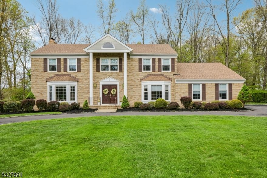 Located in the sought after Randolph Chase community, 5 Revere Ct presents an exceptional opportunity to own a home that blends classic design with everyday functionality on a flat, level lot. A circular driveway and brick and vinyl exterior create a welcoming first impression, complemented by a two-car garage with convenient main-level access. The updated white kitchen features a center island, stainless steel appliances, granite countertops, and a spacious breakfast area, opening to the family room. Anchored by a wood-burning fireplace, the family room offers multiple doors to a large deck and connects seamlessly to the formal living room. A large formal dining room is perfectly suited for entertaining, while a first-floor office or bedroom (5 bedrooms on a 4 bedroom septic), laundry room, and powder room add flexibility. Hardwood floors enhance the main level. Upstairs, four generously sized bedrooms include a primary suite with an ensuite bath featuring a jetted tub and dual sinks. An updated hall bath with double sinks serves the additional bedrooms. A finished basement expands the living space with flex rooms for additional storage or play. Major updates in 2018 include roof, furnace, and hot water heater, as well as newer windows in 2015 and 7 doors replaced in 2019, adding efficiency and long-term value. Enjoy top Randolph schools and easy proximity to neighboring Chester and Morristown.