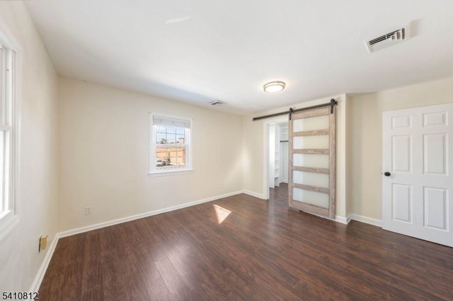 Welcome to this beautifully updated home offering modern style and functional living space throughout.The main level features a bright and open living and dining area with hardwood floors, recessed lighting, and a striking electric fireplace set against sleek contemporary wall paneling, creating a stylish focal point. The updated kitchen showcases white cabinetry, granite countertops, stainless steel appliances, and a breakfast bar peninsula designed for both everyday living and entertaining.The home offers three bedrooms and two and a half bathrooms, along with a fully finished basement complete with a kitchenette area and full bathroom, providing flexible additional space for recreation or a home office.Elegant French doors off the main living area lead to the backyard, creating a seamless flow for indoor-outdoor living and entertaining. The outdoor space includes a custom fire pit with stone seating, perfect for relaxing evenings.Conveniently located near schools, parks, shopping, major highways, and public transportation, this home offers accessibility while maintaining a comfortable residential setting. Move-in ready and thoughtfully updated throughout.