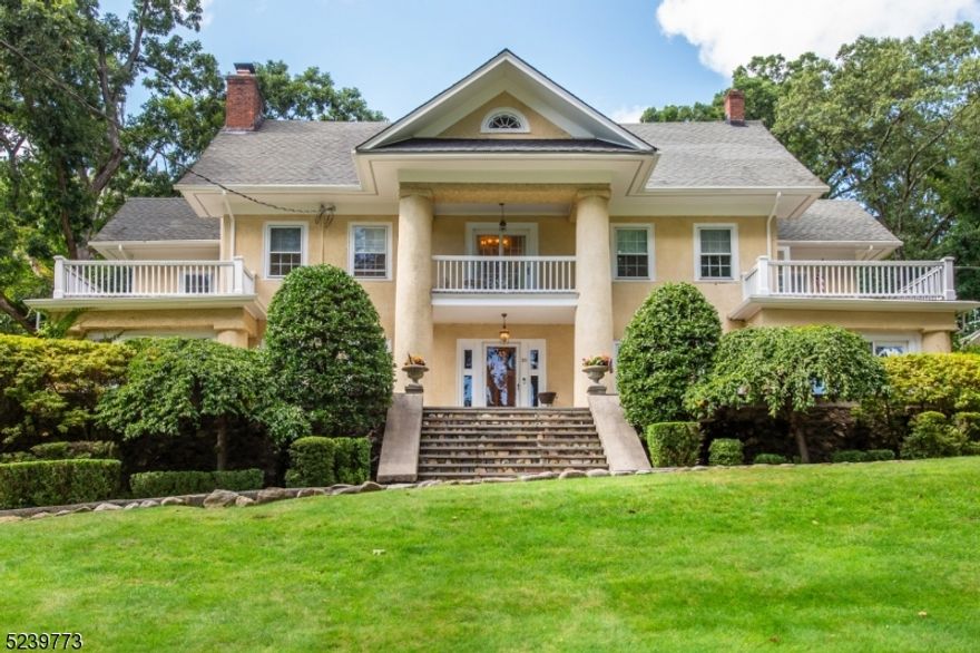 This is a spectacular property on a hill, that captures everyone's attention when driving by. This majestic colonial with its pillars, balconies, and side decks, is a rare find! One is greeted at the front open porch, then walks into a grand foyer with beautiful moldings, beamed ceilings, new light fixtures, and refurbished flooring throughout every room. There is the charm of yesteryear, but with the updates of today's living. A large, gracious dining room can entertain many guests, and the gourmet kitchens and butler's pantry, is made for a chef's dream. Two subzero refrigerators, Viking gas cooktop and ovens, custom center island with butcher block counter, marble countertops, stainless steel appliances, and marble sink, all add to the convivence of entertaining. The adjoining family room or eating area, are a part of the open floor plan. Laundry and mud rooms are on the 1st floor, as is a comfortable office. The traditional living room and fireplace, opens to a playroom or sunroom. There are 2 staircases to the 2nd floor, both leading to the primary suite and sitting room. There are large walk-in closets in most bedrooms. There are spacious bedrooms on the 2nd and 3rd floors, with bonus rooms. The finished lower level has a gym, media room, full bath, and a sauna to relax after a long day's work. The blue stone back patio brings one to a custom stone fireplace that no one wants to leave. The carriage house offers extended living in a cozy setting. This home awaits you!