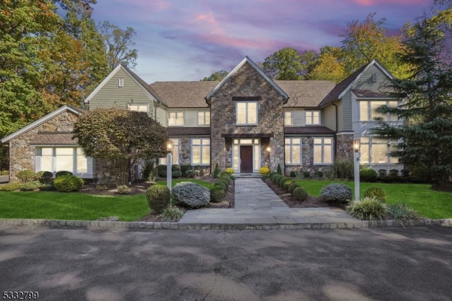 This spectacular stone front custom built home was designed to owners' highest specifications by John James AIA w/ guidance from a Feng Shui master. This home is ideally located on level 0.7 acre lot on quiet street, walking distance (approx 0.6 miles) from the SH train station, downtown, the Middle School & the Papermill Playhouse! This stunning home is western-facing, so it has incredible sunset views, & the home has 8,478 sq ft of living space along w/poured concrete foundation & saltwater pool. 1st level features 10' ceilings, a grand 2-story entrance hall, spacious 1st floor in-law suite w/full bath & office w/custom built-ins. Gourmet eat-in kitchen w/center island & top of the line appliances opens to huge 2-story family room w/wood-burning FP. Massive family room has total visibility & easy access to a large bluestone patio, stunning heated saltwater pool w/automatic pool cover, & level, fenced backyard. Attached, heated 3 car garage has easy 1st level access to the kitchen via the mudroom. 2 powder rooms on the 1st level & back stairs. 2nd level has 9' ceilings, luxurious primary bedroom w/2 massive WICs, a bespoke spa-like bath w/shower & soaking tub, radiant heated floors & a 2nd home office, 3 more bedrooms, 2 more full baths & laundry. Beautifully finished LL w/10' ceilings, large rec room w/wet bar, full fridge, nanny's suite w/full bath, exercise room & bonus room, ideal for potential media or golf simulator room. Natural gas generator. Your dream home awaits!