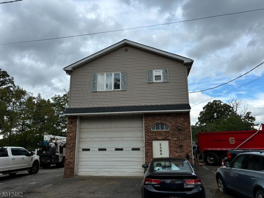 Very sought after property. Not many like this one in Scotch Plains. Excellent conforming industrial yard. 2 Lots 2365 has a free-standing building or Garage 50x23 with over head door and second floor residential apartment .Garage is a flow thru and heated by gas. Front and rear over head garage door, 12 foot. One office in garage..  next door 2369 Waldheim  open lot 70x115 . 2365 and 2369 Waldheim  are being sold together for this purchase price. Lot can store many trucks 10 plus .2 bedroom apartment above garage. Apartment 2nd floor getting 1700 per month tenant pays all utilities except garbage with a month to month lease  but  tenant would like to stay .AC and heat in second floor well kept apartment . Hardwood floors  .