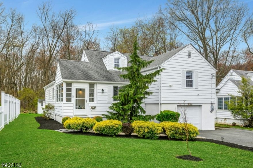 Discover this spacious, beautifully updated split-level home featuring 4 Bedrooms and 3 Bathrooms, designed for comfort, convenience, and flexible living.  The sun-filled Kitchen flows effortless into the Great Room and showcases hardwood flooring, a skylight, center island, and sliding doors that open to a deck overlooking the backyard - perfect for entertaining or relaxing.  The inviting Dining Room offers hardwood flooring, recessed lighting, creating an ideal layout for gathering. Upstairs, the primary suite features a walk-in closet, elegant crown molding, and a private bath with marble accent.  An additional Bedroom and a full hall Bathroom complete this level.  On the third floorr, you'll find a generously sized Bedroom with plenty of closet space.  The lower level adds even more versatility, offering a fourth Bedroom, full Bathroom, Laundry area, and direct walk-out access to the Backyard.  Additional features include updated bathrooms, abundant storage, central air conditioning, a tankless water heater, a deck, a one-car garage and a spacious lower level Recreation Room.  This move-in ready home truly has everything you need for comfortable everyday living.