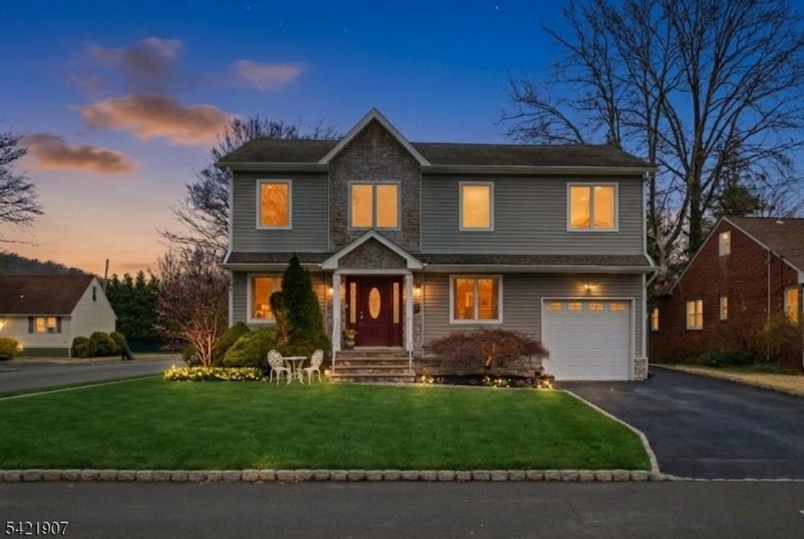 Located just across the prestigious Baltusrol Golf Club in a quiet prime section of Springfield, this newer construction home was fully rebuilt from foundation up in 2007, offering modern layout, updated systems and 3300+ sqft living space. Freshly painted in 2026, the house features an open-concept first floor ideal for both everyday living and entertaining. The sun-filled family room flows seamlessly into the renovated kitchen (2023), complete with quartz countertops, a walk-in pantry, and ample cabinetry. A first-floor bedroom and full bath provide flexible living options for guests, a home office, or in-law suite. The second level offers vaulted ceilings in all bedrooms. The primary suite includes a walk-in closet and a spacious en-suite bath with a Jacuzzi tub. Enjoy peaceful golf course views from the upper level. Additional features include solid Oak hardwood flooring throughout the main levels and an intercom system. The finished basement adds valuable living space with a large recreation room, full bath, and utility room - ideal for entertainment, fitness, or extended stays. Outdoor living is enhanced by a private patio in the fenced-in backyard, perfect for relaxing or hosting. Prime location is just a 3-minute walk to NYC bus stop walkable to Edward V. Walton Elementary School, as well as close proximity to middle and high schools, parks, shopping, and major commuter routes.
