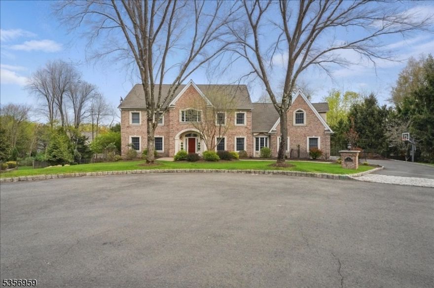Beautiful 5-Bedroom, Custom-Built Colonial Brick Home Located at the end of Quiet Cul-de-Sac in Sought-After Fardale Section of Mahwah. 2-Story Grand Foyer with wainscoting and over 7,000 square feet of living space. Features include two staircases and hardwood floors throughout the 1st and 2nd levels. The first level includes an Old English Pub room with gas fireplace, Office/Den, Great Room with cathedral ceilings, gas fireplace, and a wall of windows with backyard views. Formal Dining Room is just off the gourmet Kitchen featuring granite countertops, paneled and stainless high-end appliances, island, and large dining area. Also on the first floor: Laundry Room, two Powder Rooms, and a Mudroom leading to the 3-car garage.The second floor offers a Master Bedroom Suite with spacious Primary Bath and 2 walk-in closets. There are four additional large Bedrooms, all with hardwood under the carpet, and two Full Baths.The Finished Walk-out Basement includes a built-in bar, Media Room, Billiard Room, gym, second Family Room, Game Room, Half Bath, Workshop, and storage. A multi-level outdoor entertaining area with Trex deck off the Kitchen and Great Room leads down to a paver patio with gas firepit overlooking the Resort-like Heated Gunite Pool with new tile and coping, and professionally landscaped property. Additional updates include a new roof, gutters, shed, and updated bathrooms. Live in your own Private Resort just in time for summer!