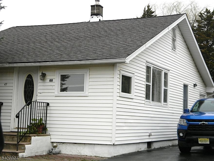 Welcome home to 49 Mabie St. Ideal for first time buyers or those wishing to downsize. Near the end of a cul-de-sac and only seconds from Route 23 for easy commuting. Enter into the generously sized foyer.  Entertain easily both inside and out. Open concept living and dining room in cooler months or host an outdoor BBQ on your patio and level fenced backyard. Detached garage with 220 electric service for all your mechanic and creative endeavors. Hardwood floors under some carpet and laminate. Ample storage in the walk-up storage room/attic and the possibility of creating extra living space.