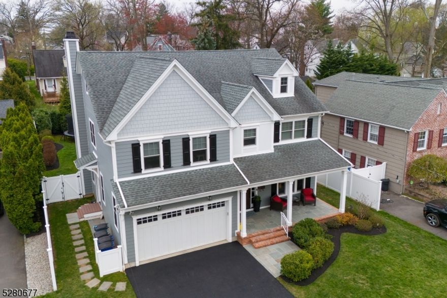 Perfectly situated on idyllic Salter Place, this 5BR Colonial is a showpiece! Note the craftsmanship, including the 9' ceilings on the 1st floor and detailed millwork throughout. The first floor is fabulous, with both formal and informal spaces to enjoy. Beyond the gracious foyer, find access to the finished 2-car garage. The mudroom provides storage, additional pantry space, and a convenient side entrance. The gourmet kitchen and breakfast room open to both the family room and to the backyard, which boasts a stunning bluestone patio, built-in gas grill, fire pit, and accent lighting. The family room, so welcoming, includes a fireplace which offers the option for either gas or wood! The flow of this home is amazing, with the living room and dining room ready for entertaining! Upstairs, continue to fall in love, with the magnificent Primary Suite, 3 additional and spacious bedrooms, the main bath with dual vanities, and the light-filled laundry room. The third floor is home to the enormous 5th bedroom, with the 3rd full bath, plus a WIC and attic storage. The beautifully renovated basement is the ideal media/recreation room, with a 4th full bath, storage closet, and utility/storage room. The newly-paved 2-car width driveway and underground sprinkler system are the icing on the cake! Located just blocks to Washington Elementary School, shops and bus stop, and less than a mile to vibrant Downtown Westfield with the train to NYC, this home is sure to impress!