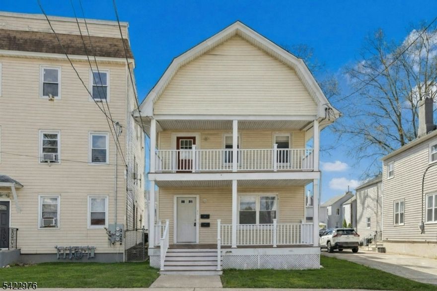 WOW! Exceptional investment or owner-occupant opportunity just 1.5 blocks to the Rahway train station a commuter's dream! This well-maintained two-family offers two bright and spacious 2-bedroom, 1-bath apartments with functional layouts, generous room sizes, and charming details throughout. Each unit features expansive living areas with two separate living rooms ideal for entertaining, dining, work-from-home space, or flexible living. Decorative fireplaces add character, while large windows bring in abundant natural light. Oversized eat-in kitchens offer ample counter space, room for dining, and great storage. Both units include two well-proportioned bedrooms, a full tiled bath, and private basement laundry access. The second-floor unit features new floors with soundproofing underlayment (2022) and updated appliances. Major upgrades include rebuilt front porches (2016), updated electrical (2019), newer heating systems (2019 & 2022), and vinyl plank flooring (2019 & 2022). Additional highlights include high ceilings, large private attic storage with potential for expansion, and a fenced backyard. Perfect for owner-occupants or investors with strong rental potential and unbeatable proximity to NYC transportation, downtown Rahway, shopping, and dining. Don't miss this opportunity!