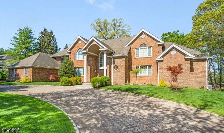 Spectacular custom 4-bedroom, 3.5-bath open-concept home located in the prestigious Bel-Air section, set on a .76-acre level lot. The recently updated kitchen features quartz countertops, a glass tile backsplash, a large center island with breakfast bar, and a sunlit breakfast room. The open great room offers volume ceilings, a new gas fireplace with stone facade, hardwood floors, and a wall of Palladian-topped French doors leading to the new Trex two-tiered deck with ambient lighting. Dining room and living room flow seamlessly off the great room, providing an ideal layout for everyday living. The first-floor primary suite includes a new luxury spa-like bath with soaking tub, separate stall shower, dual vanities, a large dressing room, and two walk-in closets. A functional mudroom off the kitchen features custom built-ins and laundry. Additional highlights include updated baths, owned solar panels, finished basement with extra-height ceilings, new garage doors with openers, a carbon water filtration system, a paver stone circular driveway, and professionally landscaped grounds. Conveniently located near houses of worship, schools, shopping, and major transportation.