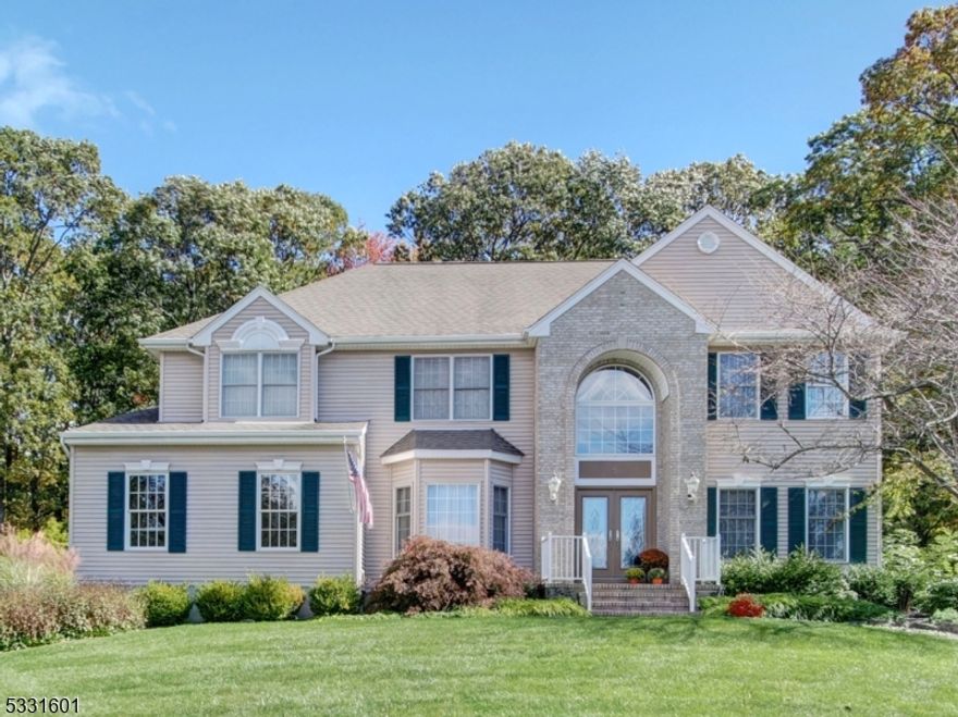 RARE FIND! Beautiful Colonial has 4 bdrms, 3 full baths,1 half bath & is located on a quiet cul de sac.This grand home stands proudly as its large footprint dominates the circular court w a well maintained landscape of mature trees, lush lawn & seasonal blooming mulch beds.This gem offers plentiful space between homes boasting a stately facade w palladium window & 2 car side garage.This beauty boasts a private backyard seamlessly blending to wooded backdrop of Green Acres. It has a very spacious interior, perfect for entertaining. Grand 2 story foyer, gorgeous wrought iron staircase & open floor plan showcases huge formal dining rm, formal living rm, family rm w brand new carpet & stone FP, big kitchen includes granite c-tops, center island, double oven, skylights & French door off expanded separate dining area to a luxurious outdoor space that combines relaxation & fun. The well-designed patio area is adorned w built in Weber gas grill, bubbly hot tub, fire/water feature & dedicated synthetic grass putting green. A home office, powder rm & laundry rm complete 1st floor. Ascend to 2nd level w all wood floors, 4 bdrms incl impressive primary suite w huge walk-in closet, luxury bath w updated shower doors, dual granite vanity, soaking tub & shower. Full finished bsmt has extra foot in height & will please all. It provides great rec space complete w full bar (included), kitchenette, full bath & storage rm. For peace of mind public utilities here & 1yr home warranty is included!