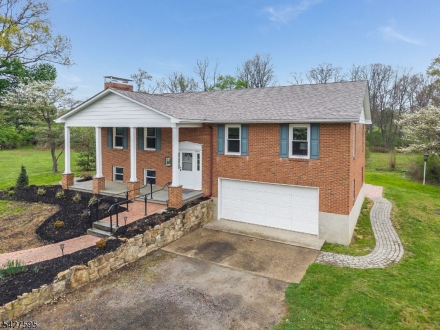 Welcome to 34 Berk Lane in beautiful Lebanon Township. Set on over 3 acres of open land with scenic views of a neighboring horse farm, this inviting home offers both comfort and tranquility. Featuring 3 bedrooms and 2 full bathrooms, the layout provides flexible living space for today's lifestyle. The main level includes a kitchen, dining room, and a welcoming living room highlighted by a charming fireplace. The ground level offers additional living space with a spacious family room, home office, full bathroom, and laundry area, ideal for work-from-home or guest. Recent updates include a new walkway, new roof and newer windows throughout most of the home, adding value and peace of mind. Enjoy the beauty of the outdoors with expansive property views and room to make it your own. A wonderful opportunity to own a home in a peaceful setting with endless potential.