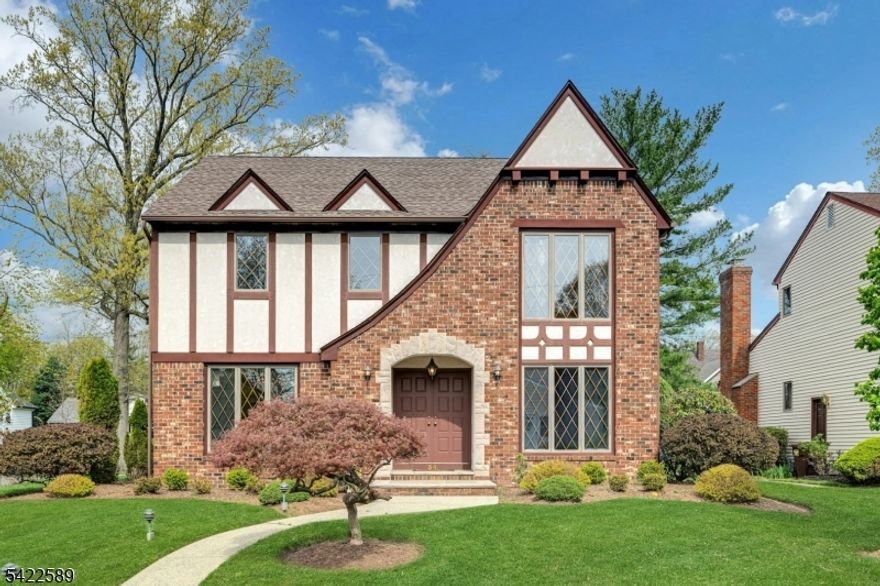 A rare gem in an ideal neighborhood within Cranford, this custom-built home by esteemed Cranford builder Angelo Buontempo is being offered for the first time by its original owner. With stunning curb appeal, a charming Tudor exterior, and a center hall Colonial layout, it blends timeless elegance with everyday functionality. Privately set on a quiet dead end street, the home enjoys direct access to Unami Park via a short path and .5 miles to Livingston school and .8 to Walnut. Meticulously maintained and in exceptional condition, this home is the epitome of "great bones". Superior craftsmanship is evident throughout, with custom woodwork details and top quality construction. A 2-story foyer sets the tone, leading to a formal dining room & spacious living room, both with gorgeous hardwood floors. The kitchen with Sub-Zero fridge opens to the family room with gas fireplace, creating an ideal flow. Hardwood floors lie beneath the family room carpeting, ready to be revealed. A 1st-floor laundry/mudroom and oversized two-car garage add convenience.Upstairs offers 3 well-appointment bedrooms, including a primary suite with large en-suite bathroom, walk-in closet, & hardwood flooring under carpeting.Additional features include 2-zone heat & cooling, Andersen windows, Hunter Douglas shades, Generac generator, and non-flood zone location.  **OFFERS DUE BY TUESDAY 4/28 11AM**