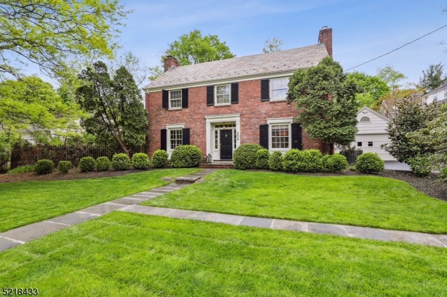 Classic North Side Colonial.  Many architectural detail including wainscot moldings in Dining Room, French style doors to screened  porch, paneled doors and  built-ins. Full brick exterior, slate roof.  Five bedrooms, three full and two half baths.  New gourmet white kitchen with center island, high end appliances and quartz counters.  Four large bedrooms on second floor.  Custom fitted closets. Oak flooring throughout all three levels.  Two fireplaces..family room gas and rec room wood burning. Screened in porch, roof top deck, large patio and a two car garage. New heating system and two zone central air. Situated on .43 of flat land.  Just a few blocks to downtown and NJ transit.  Fireplace, flue and chimney are as is with no known defects.