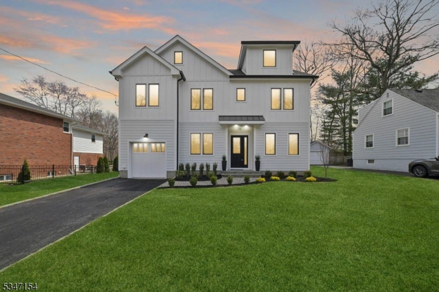 Discover luxury, style, and convenience in this stunning newly constructed 5-bedroom, 4.1-bath home. Designed for modern living, the open-concept floor plan boasts high ceilings, intricate millwork, and custom moldings throughout. The gourmet kitchen is a chef's dream, featuring quartz countertops, Jen-Air appliances, a farmhouse sink, prep sink, walk-in pantry, and beautifully crafted cabinetry. The adjoining living room, with its cozy gas fireplace, offers the perfect setting for both comfort and elegant entertaining. Practical touches include a mudroom and a second-floor laundry room. Upstairs, the luxurious primary suite impresses with vaulted ceilings, custom his-and-hers walk-in closets, and an en-suite bath with dual sinks and a spacious stall shower. The finished basement expands the living space, featuring a recreation room, additional bedroom, and full bath. Outside, Hardie Plank siding, Andersen energy-efficient windows, and a covered front entry enhance the home's curb appeal, while the oversized, level backyard offers plenty of space for outdoor entertaining and relaxation. Built with comfort and efficiency in mind, this home includes multi-zone high-efficiency HVAC, a tankless water heater, and a Superior Walls foundation. Home warranty included. Ideally situated near top-rated schools, downtown shops, dining, parks, and commuting options, this exceptional home is a must-see. Don't miss your chance to make it your own!