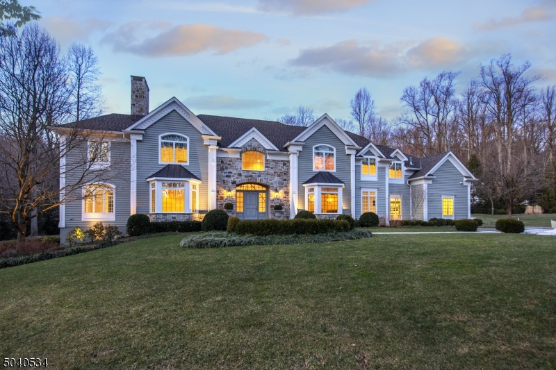 An exceptional custom home privately set beyond a gated entry on 6+ acres of fenced serenity. Convenient to shops, restaurants and mass transit options and only a short distance to airports and NYC. The landscaped grounds overlook established gardens, heated pool/spa, outdoor kitchen, fireplace and bluestone terraces. Numerous interior upgrades were made in a detailed remodel, resulting in a fresh aesthetic for this architecturally-nuanced home. The 3 finished levels offer generous formal rooms with tray and coffered ceilings, chef's center island kitchen, flexible bedroom layout w/ the opportunity for 6th BR on 1st or 2nd level. The finished walkout LL has a media room, game room, gorgeous wine cellar and spacious home gym. There is a security system, multiple HVAC zones, select radiant heating & generator.