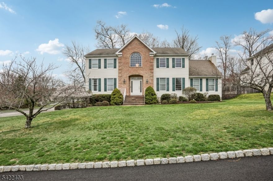 Stunning center hall Colonial offering exceptional space, style, and functionality, featuring a grand 2-story Entry Foyer, Living room, Formal Dining room and Modern Eat-in kitchen with center island, separate dining area, and sliders to a spacious deck. The inviting Family room with fireplace also provides deck access, perfect for seamless indoor-outdoor living. The first floor includes a versatile fifth Bedroom or Home Office, Full Bath, and convenient Laundry room. The second level offers Master Bedroom with walk-in closet and Master Bathroom with jetted tub and double vanity. Additional highlights include crown molding, hardwood floors, two newer central air units, central vacuum, and an unfinished basement with access to a 3 car garage. Enjoy a private backyard with an expansive deck ideal for relaxing or entertaining, along with modern amenities such as an alarm system, underground sprinklers controlled by mobile phone, and Ring doorbell and garage. Ideally located near top-rated schools, shopping, dining, and NYC transportation, this home truly offers the perfect blend of comfort, convenience, and elegance. Seller is requesting Highest & Best Offers Due by Wed. 4/15 5pm.