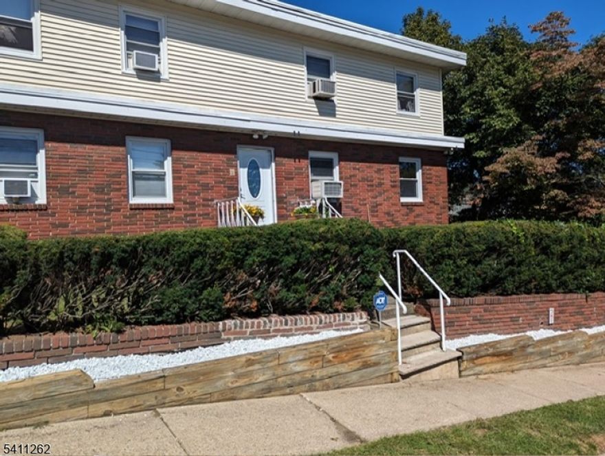 Spacious and bright first-floor apartment in a two-family home located in the Heights section of Hawthorne. Situated on a corner lot with a large private backyard surrounded by trees. The first floor offers a very spacious living room, two large bedrooms, a full bathroom, and a good-size eat-in kitchen. The fully finished basement provides additional living space, including a studio-style bedroom with a full bathroom and kitchenette (no stove), plus a separate large open area ideal for recreation, storage, or home office, along with laundry. Total of three bedrooms and two full bathrooms. Convenient location with access to local schools, public transportation, and major highways including Routes 208, 287, and 4.