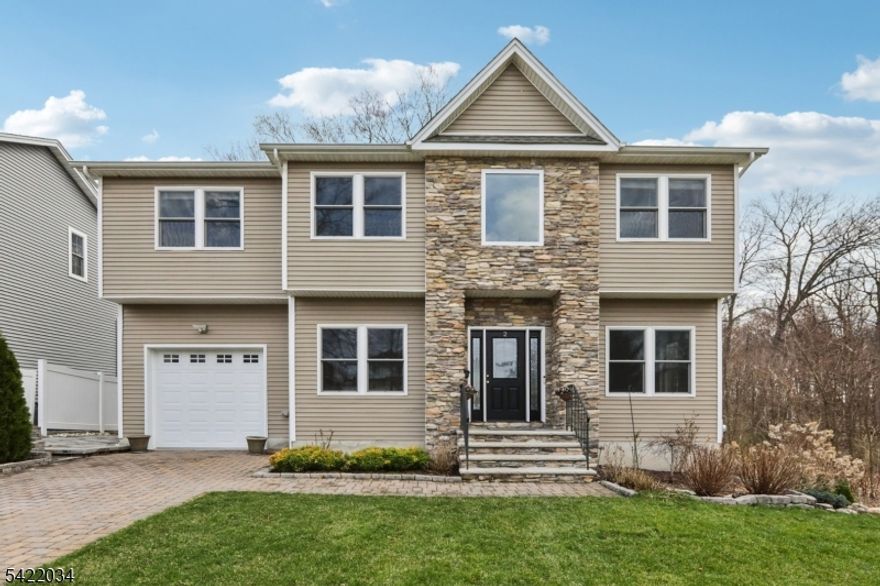 This stunning 5 1/2-year-old Contemporary Colonial is move-in ready and offers the perfect blend of modern luxury and suburban convenience, ideally situated on a quiet cul-de-sac within the highly regarded Parsippany School District. Boasting four spacious bedrooms and four full bathrooms, the home features sophisticated updates throughout, including a second-floor laundry room for ultimate convenience and a private primary suite complete with a double vanity and a sleek freestanding soaking tub.The bright, open-concept living spaces flow seamlessly, complemented by an attached single-car garage and a striking exterior with premium stone accents. A fully finished basement adds exceptional versatility, featuring an additional full bathroom and a bonus room ideal for a home office, gym, or guest space.Outdoor living is equally impressive, featuring a low-maintenance Trex deck and additional patio pavers, providing ample space for entertaining, dining, and relaxation.Perfectly located, this like-new residence is within easy walking distance to Volunteers Park and Beverwyck Road, offering a rare opportunity to own a modern masterpiece in a premier Lake Hiawatha location.