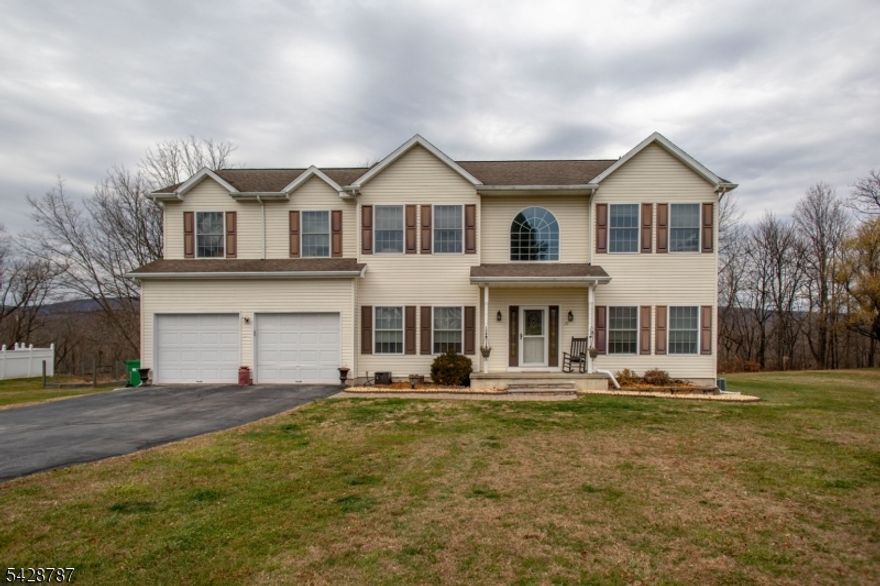 Welcome to this very Spacious Colonial.  This Center Hall Colonial is Warm and Inviting.  As you enter the Living Room is to the Right.  The Dining Room to the Left is perfect for Gatherings.  An open Concept Kitchen and Family Room are where most of your Day to Day living will be.  The Kitchen has all the right Ingredients; Granite, Stainless Appliances, Island and Space for Informal Dining.  Take in the View of "Sunrise Moutain" from the Deck.  Upstairs you will find a Large Primary with a Renovated Bathroom.  A Relaxing Ensuite.  There are 3 more Bedrooms, an Office/Bedroom and a Full Bath also Renovated.   The Basement is HUGE.  This could be a Finished Space if you wish. The Current Owners have really made this house a HOME.   Now it's time for you to make it YOURS.   County Records show a 4 Bedroom Septic.