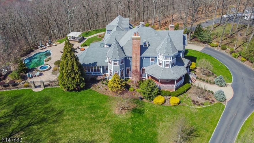 Stunning Custom built Victorian home with all of the modern features one could wish for. This 5 bedroom 5.1/2 Bath home has hardwood flooring, high ceilings, huge laundry room, spa like baths, fabulous offices to work from home and guest suite over the garage . Upgrades include: Elan House Automation: Smart technology (high speed internet Wifi thermostats, Interior & Exterior Speakers &video camera's. New pool liner, pump & heater 2022. New dog run, New Fixtures though out entire home and generator. Area is close to major hwys, wonderful center of town and blue ribbon school system.