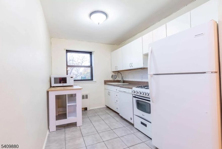 Spacious 711 SqFt, 1 bedroom condo in elevator building at desirable Briar Hall! Commuter's dream - NYC bus at the corner and just a few blocks to the train. Conveniently located to all that Rutherford has to offer - shops and excellent dining a short walk away. Hardwood flooring throughout and over-sized windows allowing nice natural sunlight, freshly painted & plenty of closet space. Heat and hot water included. New window AC units included. Bike rack, storage and shared laundry in basement. Unit is located in back of building - quiet and views of the foliage.