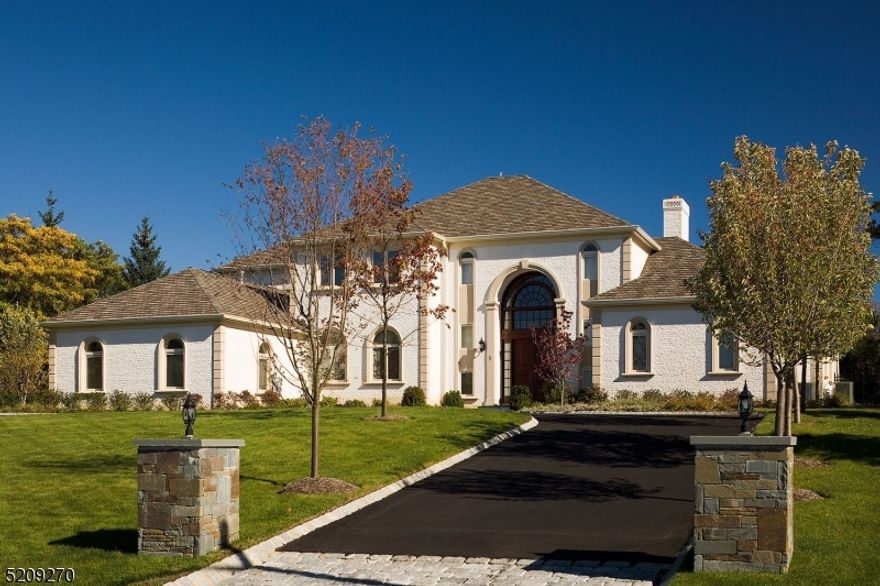 Experience luxury at its finest in this exceptionally built home filled with grandeur and stunning attention to detail. Enjoy nearly an acre of meticulously manicured property located at the end of a cul de sac on the most premier street in all of Livingston. Enter this 5 bedroom, 6 1/2 bath brick custom home through the impressive 2 story foyer which looks out to the living room that boast floor to ceiling slider/windows with views of the park like back yard. Luxurious first floor master includes 2 full bathrooms, 2 walk-in closets, an office and sliders to the backyard. 1st level also features huge EIK, formal dining room, traditional study, guest room quarters w large bedroom and full bath, access to the massive heated garage and everything and anything else you could dream of for entertaining, working and relaxing! Take the elevator up to the 2nd floor where you will find 3 additional bedrooms each with their own ensuite bathroom and multiple custom walk in closets.