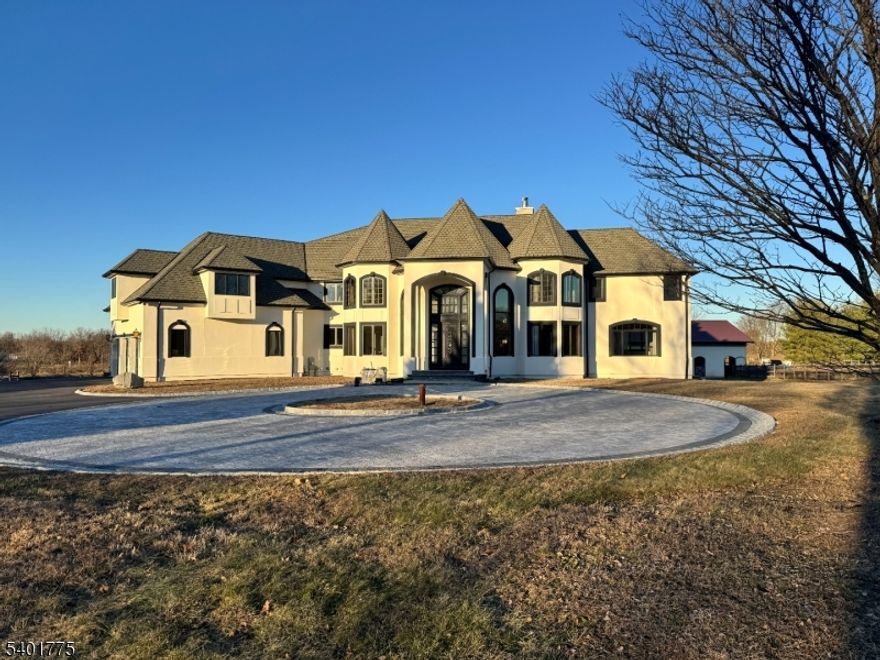 Introducing a highly sought-after, one-of-a-kind Somerset masterpiece! This custom-built estate (2007) showcases over $3M in premium materials and grand-scale design. The open floor plan is bathed in natural light from oversized windows, complemented by elegant alabaster fixtures. Comfort is ensured with high-velocity multi-zone HVAC and 23 radiant heat zones. The chef's kitchen impresses with an expansive granite island, custom cabinetry, large pantry, and top-tier appliances including a paneled Sub-Zero fridge, Bosch dishwasher, and Dacor 6-burner range. Four balconies offer sweeping views of an equestrian farm and Spooky Brook Golf Course. Enjoy four fireplaces, including one in the private home office - perfect for today's work-from-home lifestyle. The primary suite is a serene retreat with a balcony, fireplace, sitting room, and spa-like bath. Elevator-ready shaft adds future convenience. Equestrian lovers will value the heated barn with four 12' x 12' stalls (expandable to six), 14-ft aisleway, loft storage, arenas, run-ins, paddocks, and direct Colonial Park trail access - plus income potential. Recent upgrades: modern black/white stucco, new blacktop and paver circular driveway and blue stone/paver patios and landing, refinished wood floors, and fresh interior paint (2023"2025). This one-of-a-kind property blends luxury, functionality, and equestrian excellence - a rare opportunity to own an estate that dazzles at every turn! PROFESSIONAL PHOTOS COMING SOON.