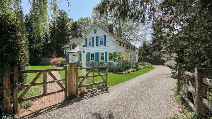 Located in the coveted Wychwood section of Westfield, this distinguished Farmhouse estate seamlessly marries timeless craftsmanship with refined modern luxury, set on a private, impeccably landscaped .41-acre property. The main level showcases an expansive Living Room and formal Dining Room, each with wood-burning fireplaces, alongside eat-in kitchen that opens to an inviting family room. This thoughtfully designed space flows effortlessly to a trellised bluestone patio an idyllic setting for sophisticated entertaining and serene outdoor living. A mudroom, laundry room, private home office, and powder room complete the first floor. The second level offers 5 generously proportioned bedrooms, abundant storage including 4 hall closets, a beautifully updated main bath, and an impressive rear-facing Primary Suite featuring a vaulted ceiling and dual walk-in closets. The lower level presents a versatile bonus space. Perfectly situated near top-rated schools, shopping, dining, parks, train, bus and more. This residence is a true Wychwood gem: graceful, refined, and rich in character, embodying the very best of Westfield country living.