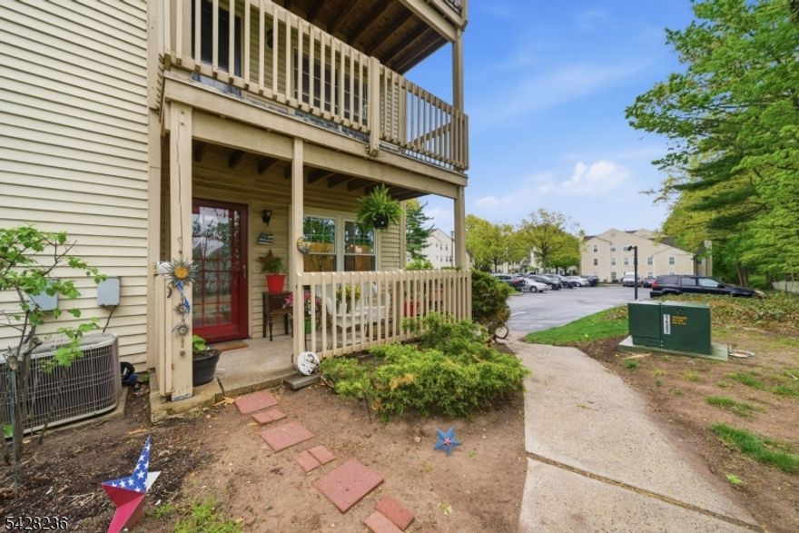 Don't miss this opportunity to live in one of Clifton's most sought-after communities, the perfect place to call home whether you're a first-time buyer or looking to downsize without sacrificing comfort. This beautifully-maintained spacious, ground-level, 2BR, 2BTH corner unit in the Evergreen community offers the rare condo experience that truly lives like a home. Everything on one level, a private entrance directly from the parking lot, and a covered porch that backs to mature trees and lush greenery, giving you the kind of quiet, private outdoor space that's hard to find in a condo setting. Inside, enter into the living room as natural light floods every room. The eat-in kitchen and formal dining room offer flexibility for everyday living and easy entertaining, while the primary suite features a generous walk-in closet and a beautifully renovated en-suite bathroom (2025). The second bedroom is spacious and versatile, with another full hall bathroom. The unit comes equipped with in-unit laundry room, all brand-new windows (2026), fresh paint, newer flooring, a newer HVAC unit and condenser (2022), and a wood-burning fireplace that adds warmth and character. Completely move-in ready. Low HOA fees. Low taxes. And a location that delivers. Commuters will love the seamless access to major highways, express bus lines, and NJ Transit bus and train service into NYC, plus Trader Joe's, Costco, Target, and more just minutes away.