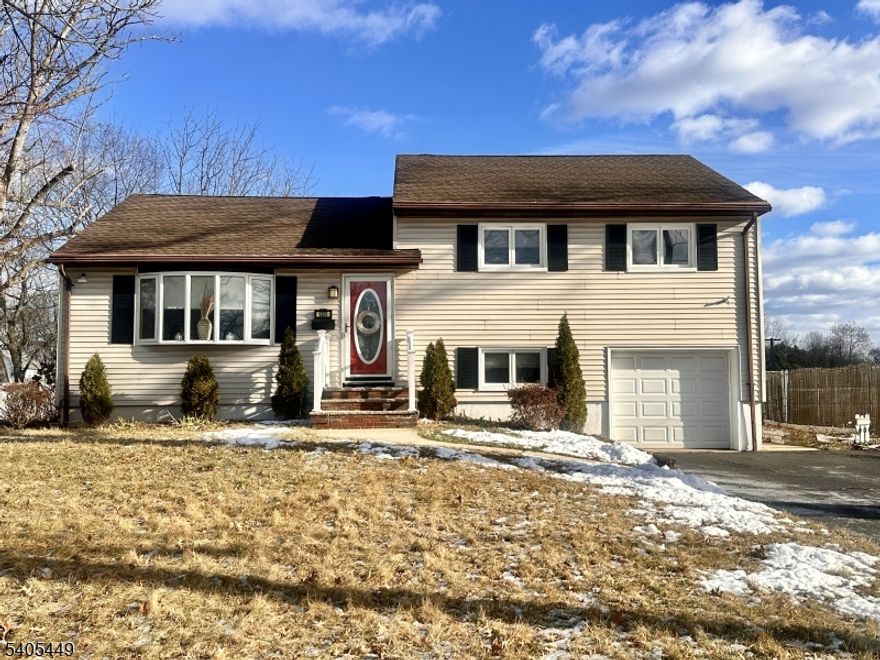 This refined single-family bi-level home offers 3 bedrooms and 3 full bathrooms, blending modern upgrades with timeless appeal. The main living level features brand-new wood flooring throughout the living room, dining room, and kitchen, creating a seamless and sophisticated flow. The fully renovated kitchen is appointed with new stainless steel appliances, modern finishes, and functional design ideal for both everyday living and entertaining. Additional highlights include central air conditioning, forced hot air heating, and natural gas service. The finished full basement provides versatile living space suitable for a recreation room, home office, or guest accommodations. Recent major improvements include a new roof and new electrical system, offering long-term peace of mind. Set on an expansive 0.29-acre lot, the outdoor space is enhanced by an in-ground pool, delivering a private, resort-style setting. A single-car attached garage/carport adds convenience and practicality. Move-in ready and thoughtfully updated, this home delivers comfort, style, and lifestyle in one exceptional offering.