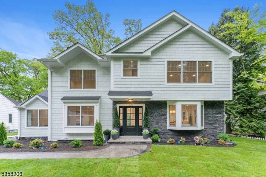 236 Glen epitomizes where cutting-edge design meets classic elegance. This expansive 3-level home showcases an open floor plan, offering dedicated spaces for an office, living room, and lounge, all centered around a gourmet kitchen equipped with top-tier Wolf appliances, sleek finishes, and abundant counter space. The kitchen effortlessly connects to the living and dining areas, providing an ideal backdrop for both cozy nights and lively gatherings. A guest en-suite on the main floor adds versatility, perfect for visitors or flexible use.The upper level features four generously sized bedrooms, including a luxurious primary suite with a spa-like en-suite bathroom and a walk-in closet. A second-floor laundry room enhances daily convenience. One of the home's standout features is the rooftop patio, offering sweeping views and the perfect spot for outdoor leisure.The third level completes the home with a spacious bedroom, lounge, and bathroom, adding to the overall comfort and flexibility. Set on nearly half an acre, this property combines modern luxury, upscale amenities, and a seamless transition between indoor and outdoor living. 236 Glen is conveniently located within walking distance of the train.