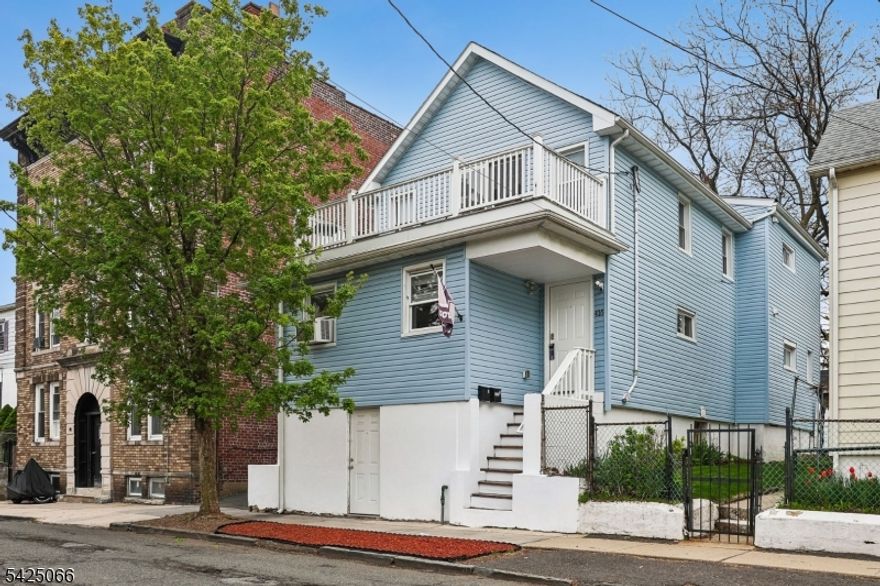 Updated well kept two-family residence ideally situated in a quiet, convenient Orange location. Just two blocks from NYC transportation and close to schools, shopping, and entertainment.The ground level offers walk-out bonus space, while each unit includes a well-designed layout with 2 bedrooms, a living room, eat-in kitchen, dining area, updated kitchen finishes, and tiled bathrooms. The second floor mirrors a similar functional layout. Exterior highlights include a fenced-in yard, paved asphalt driveway, and detached garage offering additional storage. Strong investment opportunity with modern systems and low-maintenance appeal throughout.