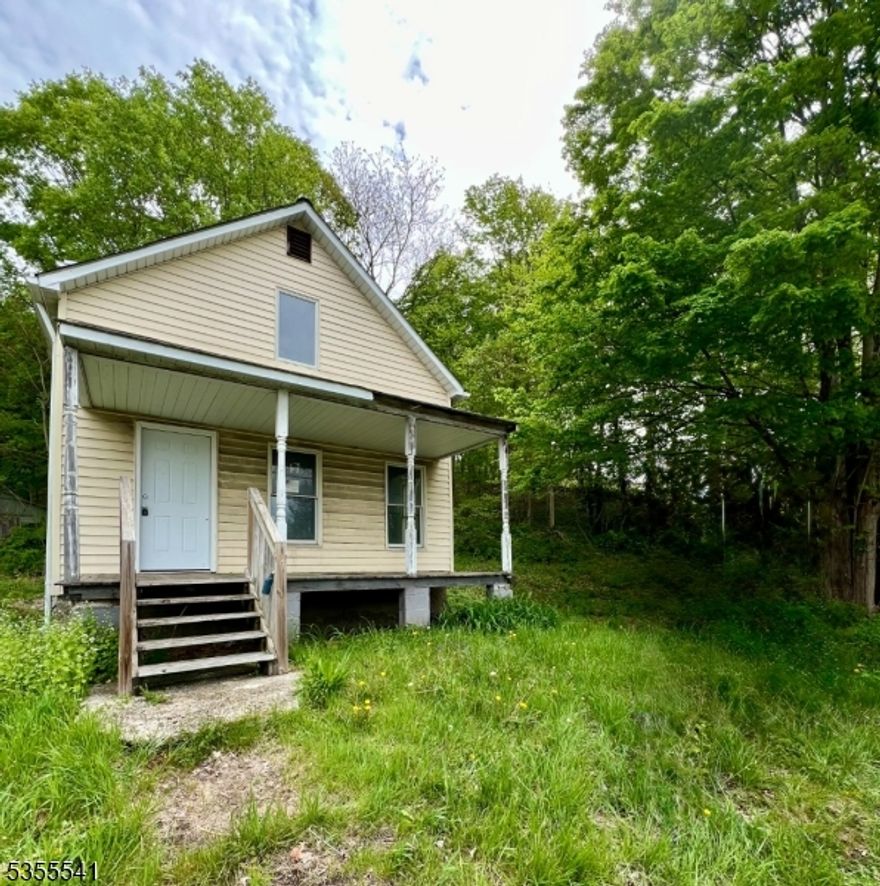 Opportunity Awaits in Wantage! Bring your vision and your tools to this gutted 3 bedroom/1 bath home located directly across from scenic Clove Acres Lake. Offering beautiful lake views and a peaceful setting, this property is a blank canvas ready for your transformation. The home has been completely taken down to the studs, providing the perfect opportunity to rebuild to your specifications. Enjoy relaxing mornings or quiet evenings on the covered front porch as you take in the tranquil surroundings. Corporate owned and being sold strictly as-is. Buyer is responsibel for any/all municipal inspections/CO required for property transfer.  The condition of the well and septic is unknown. Cash or renovation financing likely required. Don't miss the chance to create your dream retreat or investment property in a serene location with lake views!