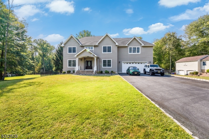 Welcome to this sophisticated home on a 1.12-acre lot in the desirable Foot Hill Area. Offering luxurious living space, this 5-bedroom, 5-bath residence features sunlit rooms with Brazilian cherry hardwood floors, soaring ceilings, and elegant millwork. The grand two-story foyer welcomes you with a striking wrought iron and wood staircase. The formal living room and dining room exude elegance with box beam ceilings, detailed molding, and abundant natural light.  The heart of the home is the family room, complete with a cozy fireplace and clearstory windows, while the adjacent chef's kitchen boasts stainless steel appliances, Brazilian cherry cabinets, granite countertops, a center island, a reverse osmosis water system, and a walk-in pantry. The breakfast area opens to a deck for outdoor dining. Upstairs, the private master suite offers a lighted tray ceiling, a luxurious bath with a glass-enclosed shower, a whirlpool tub, and walk-in closets. Four additional bedrooms, 2 full baths, and a laundry room complete this level. The walk-out finished basement adds more living space, including a second laundry room and full bath, ideal for guests. This home includes a multi-zone HVAC system, a two-car garage, a 6-car driveway, and beautifully landscaped grounds with a patio. Schedule your private tour now!!!