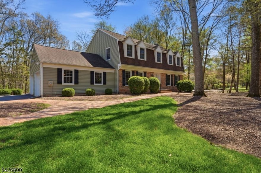 Welcome to this timeless Neo-colonial residence nestled on a sun-dappled, park-like lot in highly desirable Bridgewater Township.Proudly built, occupied,and meticulously maintained by its original owner since 1979, this 4-bed, 2.5-bath home awaits its' next chapter! A sense of warmth and continuity is felt throughout, offering both comfort and opportunity for personalization.The main level features a thoughtfully designed center-island kitchen with stainless steel appliances, complemented by adjacent laundry & powder rooms for everyday ease. Just beyond, the inviting family room centers around a stately brick wood-burning fireplace and opens seamlessly to an outdoor deck through sliding glass doors perfect for relaxed indoor-outdoor living.Formal living and dining rooms provide classic spaces for entertaining and gathering, while the home's layout supports both connection and privacy.Upstairs, the spacious primary bedroom features an en-suite bath and walk-in closet. Upgrades in recent years include NEW windows &bath and in recent months,a NEW furnace and AC/condenser unit, providing both efficiency and peace of mind.The basement presents exciting potential for expansion ideal for a future family room, creative studio, or flexible living space. An additional electrical sub-panel,previously used to power a kiln,opens the door to a variety of uses for hobbyists or makers.With its solid construction, thoughtful upgrades and serene setting, this is a wonderful place to call home!