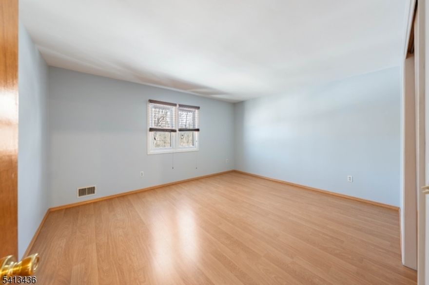 Welcome to this move-in ready Colonial home in the desirable Parkside Manor neighborhood, with updates in 2026. With undeniable curb appeal, architectural character, and a private driveway leading to a two-car garage, this home makes a first impression. The exterior showcases warm wood tones, classic detailing, and a fenced backyard just a short stroll from the neighborhood playground. Inside you'll discover a bright and inviting main level featuring an effortless flow designed for today?s lifestyle. The spacious living room boasts soaring ceilings and an open, airy feel, seamlessly connecting to the backyard for easy indoor-outdoor living. A formal dining room provides the setting for gatherings, while the kitchen offers abundant cabinetry, stainless steel appliances, a pantry for additional storage, and generous counter space for meal prep. A convenient half bathroom and a dedicated laundry room complete the first floor, adding everyday functionality and comfort. Upstairs, the second level features three bedrooms, including a primary suite with its own full bathroom for added privacy. An additional full bathroom serves the remaining bedrooms. The third-level attic provides additional storage potential, while the unfinished basement offers endless possibilities for future expansion.