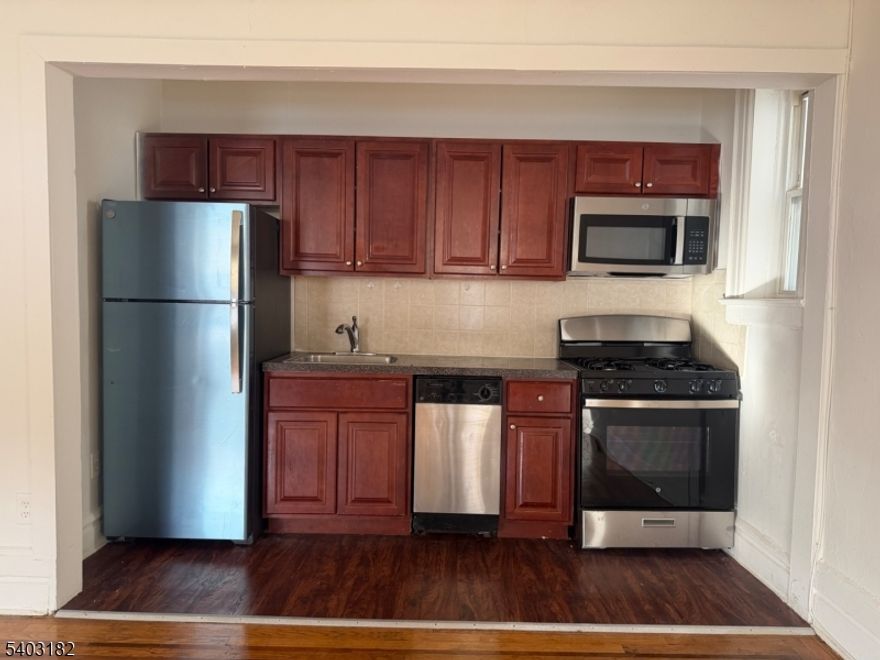 Charming and spacious 1-bedroom, 1-bathroom apartment available in a beautifully renovated historic building under new management in the heart of Bloomfield. This bright residence features original hardwood flooring throughout, 9-foot ceilings, and ample closet space. The updated kitchen offers cherry wood cabinetry paired with stainless steel appliances, blending classic character with modern convenience.Building amenities include on-site laundry and elevator access. Carport parking available for an additional fee. Pet-friendly community (pet fee applies). Multiple units available.Ideally located within walking distance to downtown Bloomfield, with easy access to major highways and mass transit, making commuting a breeze.Welcome home to Franklin Towers, Schedule your tour today! Under new Management.