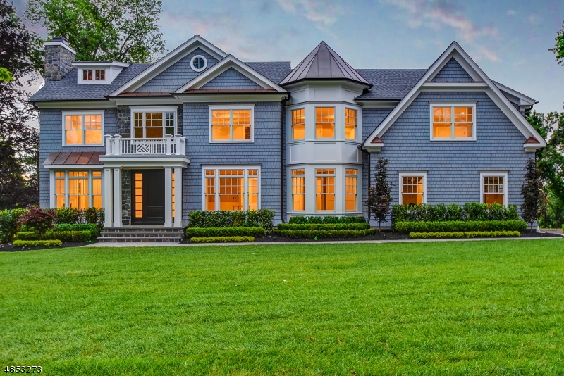 Gorgeous New State of the Art Colonial with ideal open floor plan with 9' ceilings on the 1st floor. Ideally located on quiet, prestigious North Side street with NYC skyline views just a .7 mile walk to the Summit Train Station & incredible downtown Summit! Spectacular gourmet eat-in kitchen with caesarstone & quartz countertops, Wolf, SubZero & Miele SS appliances, 1st floor In-Law Suite. Luxurious Master Suite w/ massive dressing room, custom walk-in closet & spa-like master bath with radiant heated floors, soaking tub & stall shower. 4 additional en suite bedrooms on 2nd floor. Walk out finished lower level w/ nanny's suite & rec room! Smart House features WiFi & Nest thermostats, poured concrete foundation, every amenity including whole house generator! Distinguished builder with 25 years experience!