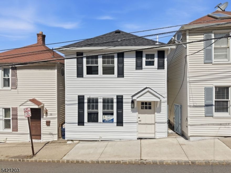 Totally renovated townhouse featuring 2 bedrooms, 2 full baths, and two dedicated parking spaces a rare find in the heart of Morristown. This move-in ready home offers modern finishes and updated baths throughout. Ideally located near the Morristown train station, making it perfect for an easy commute to NYC. Just steps from Headquarters Plaza, shops, dining, and nightlife. Enjoy low-maintenance living with unbeatable walkability in one of Morristown's most desirable locations.