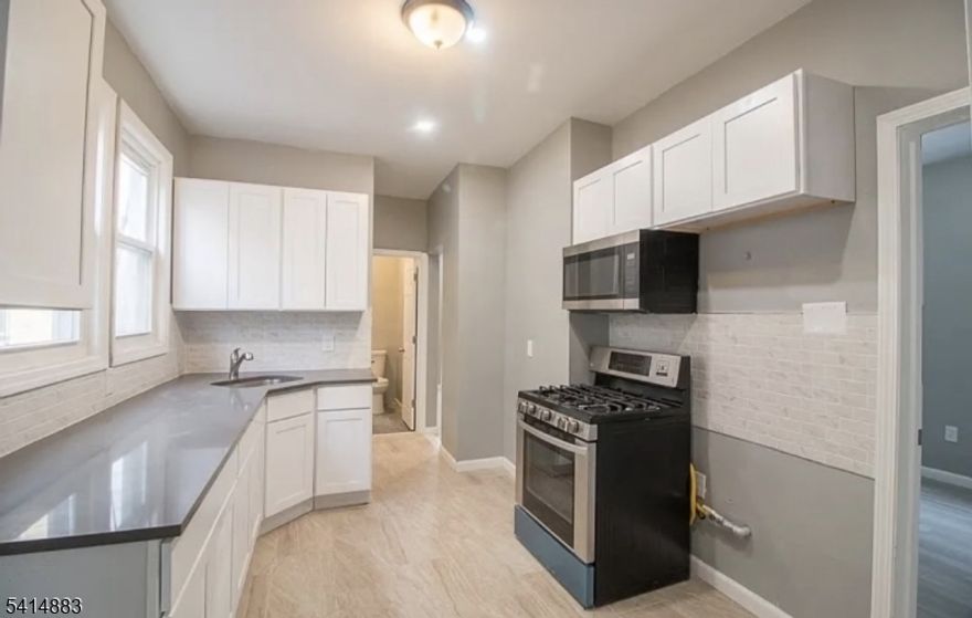 Second-floor apartment featuring nice finishes, 3 spacious bedrooms, and 1 full bathroom. Includes convenient in-unit laundry and 1 parking space, all included in the rent. Ideally located in East Orange near major highways, public transportation, shopping, and local amenities, making commuting and daily errands easy. Comfortable layout and move-in ready.