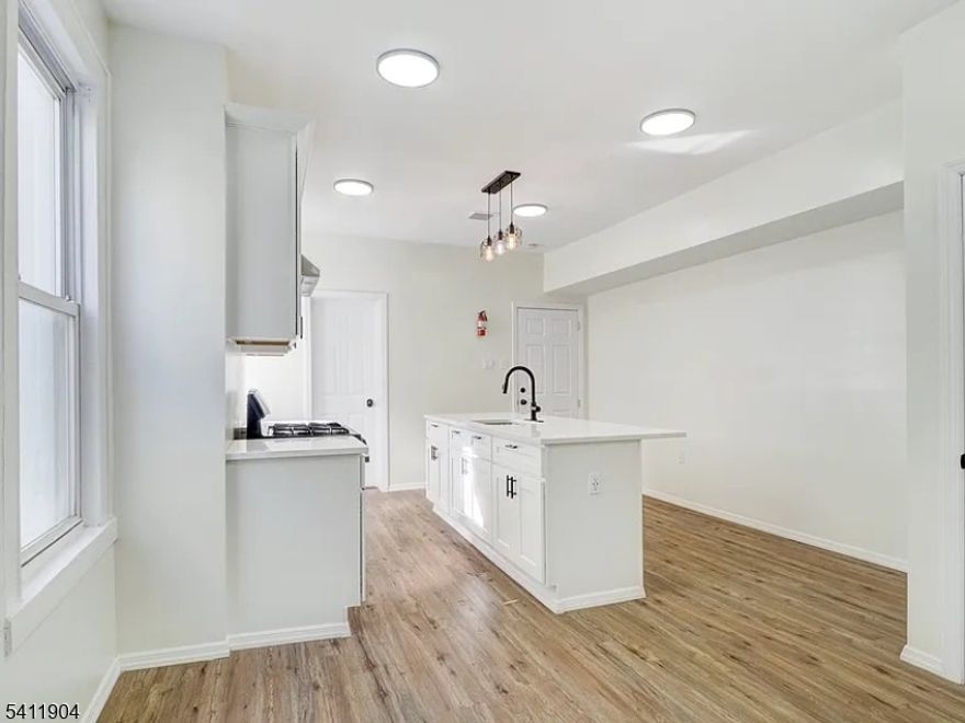 Welcome to this beautifully maintained first-floor 2-bedroom, 1-bath apartment offering comfort, convenience, and modern living. This thoughtfully designed unit features a bright and spacious layout with generous room sizes and great natural light throughout. The living area provides a warm and inviting space perfect for relaxing or entertaining. The kitchen offers ample cabinet storage and counter space, making meal prep simple and functional. Both bedrooms are well-proportioned with closet space, ideal for comfortable everyday living or a home office setup. Enjoy the ease of first-floor access, making move-in and daily living effortless. Conveniently located near major highways, public transportation, shopping, and dining, this unit offers both accessibility and practicality.