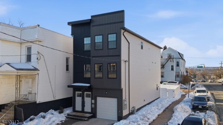 Turn this brand new 2 family into an income-producing asset. Ideal for an owner occupant or an investor. This brand new construction 2-family has 7 bedrooms and 4.5 bathrooms across two thoughtfully designed units. Each unit features a spacious master ensuite, open-concept living, and a modern kitchen with sleek cabinetry, quartz countertops, and a center island that flows seamlessly into the dining and living areas.This modern two family also Includes an attached garage, pre-installed security system, and a new construction home warranty for added protection.With a 5-year tax abatement and eligibility for CRA low-interest financing, this is a rare opportunity to secure favorable terms while building equity in a commuter-friendly location just 20 minutes from NYC.