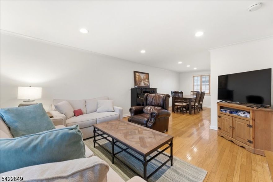 Four Levels of Finishes Living Space perfectly positioned in the heart of Westfield's highly sought-after Northside. This beautifully crafted townhouse offers an unbeatable lifestyle just steps to top-rated schools, vibrant downtown shopping and dining, and the NJ Transit train to NYC. Spanning four thoughtfully designed levels, this home features a gourmet kitchen with premium appliances by Thermador, Jenn-Air, and Miele, sleek soft-close cabinetry, and granite countertops ideal for everyday living and effortless entertaining. The open-concept Living/Dining Room provides the perfect backdrop for gatherings or quiet nights at home. Upstairs, two spacious bedrooms with ample closets share a stylish full bath. The finished attic offers flexible space for a home office, studio, or guest area, complete with custom built-in wardrobes. The lower level extends your living options with a large rec room, another full bath, and a full-size laundry room with extra storage. Located directly across from beautiful Mindowaskin Park and just a short stroll to award-winning schools, downtown Westfield, and the train station, this home offers the ultimate in walkable convenience and modern comfort. A private one-car garage completes the package!
