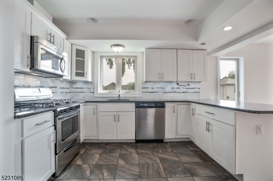 Stunning unit in prime location! only two blocks from train, access to major highways and downtown Linden. This 2 level apt offers lots of natural light. Inviting foyer with coat closet that leads to the spacious and open space living room with gleaming hardwood floors. Open concept and gorgeous kitchen with breakfast bar. Powder room and laundry room on main floor. Upstairs with two spacious bedrooms with lots of closet space and a full bath. Central AC and heating.  One parking spot assigned and storage on ground floor of the building. This is a must see! NTN report (background check and credit combined) employment verification required. No pets or smokers. Tenant pays ALL utilities including water. Min. credit score 650.  One year lease minimum. Available now.