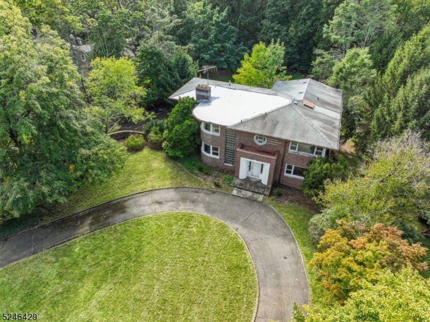 Bring your dreams and vision to make this timeless Old Short Hills Colonial your own ! Located on one of the most prestigious streets and neighborhoods in Short Hills. Stately home with low taxes and high architectural integrity w/ fabulous period details and endless potential. Located .6 miles to the Short Hills Station, this 5/6 Bdrm, 4 Full and 1 Half Bath home boasts approx. 4300 sq ft of living space (excluding lower level) w/ large rms, significant closet space and abundant natural light. Sprawling 1st floor  features Grand Foyer with statement staircase. Formal Dining Rm, Living Rm w/ fireplace, rounded windows and built-ins. Spacious Family Rm w/ direct access to Sun Rm. Immense potential for the Kitchen of your dreams in a light-filled, expansive space w/ Mud / Laundry Rm + Pantry. Powder Rm and convenient Bdrm / Office w/ adjoining Full Bath completes 1st floor. Second-floor Primary Suite features Dressing Area and Bath. 3 more Bedrooms on this level are all connected to full Bath. Full Lower Level w/ steel beam support and potential for a rec rm, office, media rm or extra bedroom. Attached 3-car Garage completes this level. Flat, lush and private property has plenty of rm for a pool. Please bring your architect, contractor and inspectors prior to submitting an offer. Well built Estate Sale in top rated school district awaiting your updates. Sold strictly AS IS; Seller disclaims express or implied warranty of habitability, and any warranties on property systems.