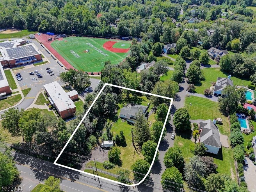 Welcome to 2 Dutch Lane, a rare opportunity to own a piece of history in Scotch Plains. Situated at the entrance of a private cul-de-sac featuring only six homes, this charming 4 bedroom, 3.5 bath turn of the century Colonial sits on a full acre of property. After entering the home through a bright and airy sun porch, you'll enter the inviting family room that showcases a striking stone fireplace and provides a warm centerpiece for everyday living. The beautifully updated kitchen features a Wolf range and hood as well as a large center island with plenty of seating and work space. The spacious primary bedroom has (2) walk-in-closets, a two-sided fireplace that opens to a sitting room, and a pair of sliding glass doors that open to the rear deck. Adjoining the bedroom is an elegant primary bath with his and hers vanity, a claw foot tub, a custom stall shower and private toilet closet. The home offers ample storage with both a full basement and a walk-up attic. This home blends timeless character with modern updates, while still leaving room for a buyer's personal touch. With its historic charm, expansive property, and unlimited potential, 2 Dutch Lane is truly a unique find that will not last.