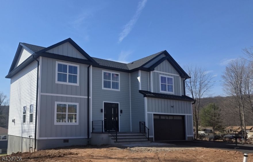 Modern Elegance Meets Lake community  Living! Be the first to own this stunning, brand-new construction nestled in a sought-after West Milford lake community. Spanning over 2,400 sq. ft. of bright, open-concept living space, this home offers the perfect balance of mountain tranquility and suburban convenience. Enjoy the comfort of high-efficiency central air and heating year-round. The heart of the home is a spacious living area equipped with full central climate control (hot/cold) for year-round bliss. Retreat to the private primary ensuite, a true sanctuary featuring a spa-like bath and amazing walking closets. With 3 generous bedrooms, office space, 2.5 baths, and a 2-car garage, there is room for everyone. Situated on a manageable 0.25-acre lot, you get the beauty of the Highlands with the convenience of being just 20 minutes from Willowbrook Mall. Why wait for a resale when you can be the first to call this masterpiece home? Your dream lifestyle starts here!