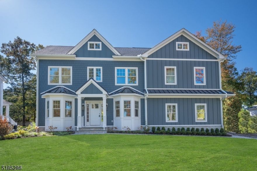 Upscale new construction with superior craftsmanship with over 6,000 sq ft of finished living space. This handsome home is set on a flat .36 AC lot that affords gorgeous views of Canoe Brook golf course. With 6 bedrooms including a bedroom on the 1st floor and lower level, a 3rd-floor bonus room with over 1,000 sq ft of finished space and multiple options for private office space, this home offers the ultimate flexible floor plan. The 1st and 2nd floors have 5" white oak floors and 9 ft ceilings. The fireside great room is open to the kitchen and has lofty 16 ft ceilings. The kitchen with white shaker cabinets, a custom curved Hoodsley wood hood, Calcutta Prado quartz counters and a contrasting center island includes a high-end appliance package (Viking 48" Range, 42" Jen-Air fridge, Sharp microwave drawer, and XO beverage fridge). The kitchen offers access to a walk-in pantry and a wet bar with a 46-bottle wine refrigerator. The primary suite is spacious and airy with 14 ft ceilings with custom arched millwork detailing, an oversized walk-in closet, an office that could also be converted to a second closet and the primary bath with his and hers sinks, soaking tub, walk-in shower and a separate room for the commode. With its 10 ft. ceilings, the lower level includes a large, open recreation space with storage closets, a gym, and a full bedroom and bath. This meticulously built home was designed by Thomas Baio, Architect with interior design choices by Karen B. Wolf Interiors.